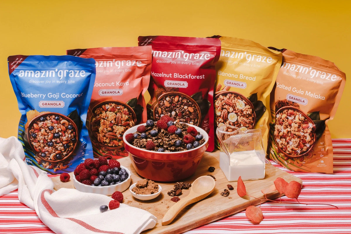 Healthy granola served as a crunchy topping alongside fresh breakfast ingredients for smoothie bowls, oatmeal, and toast.