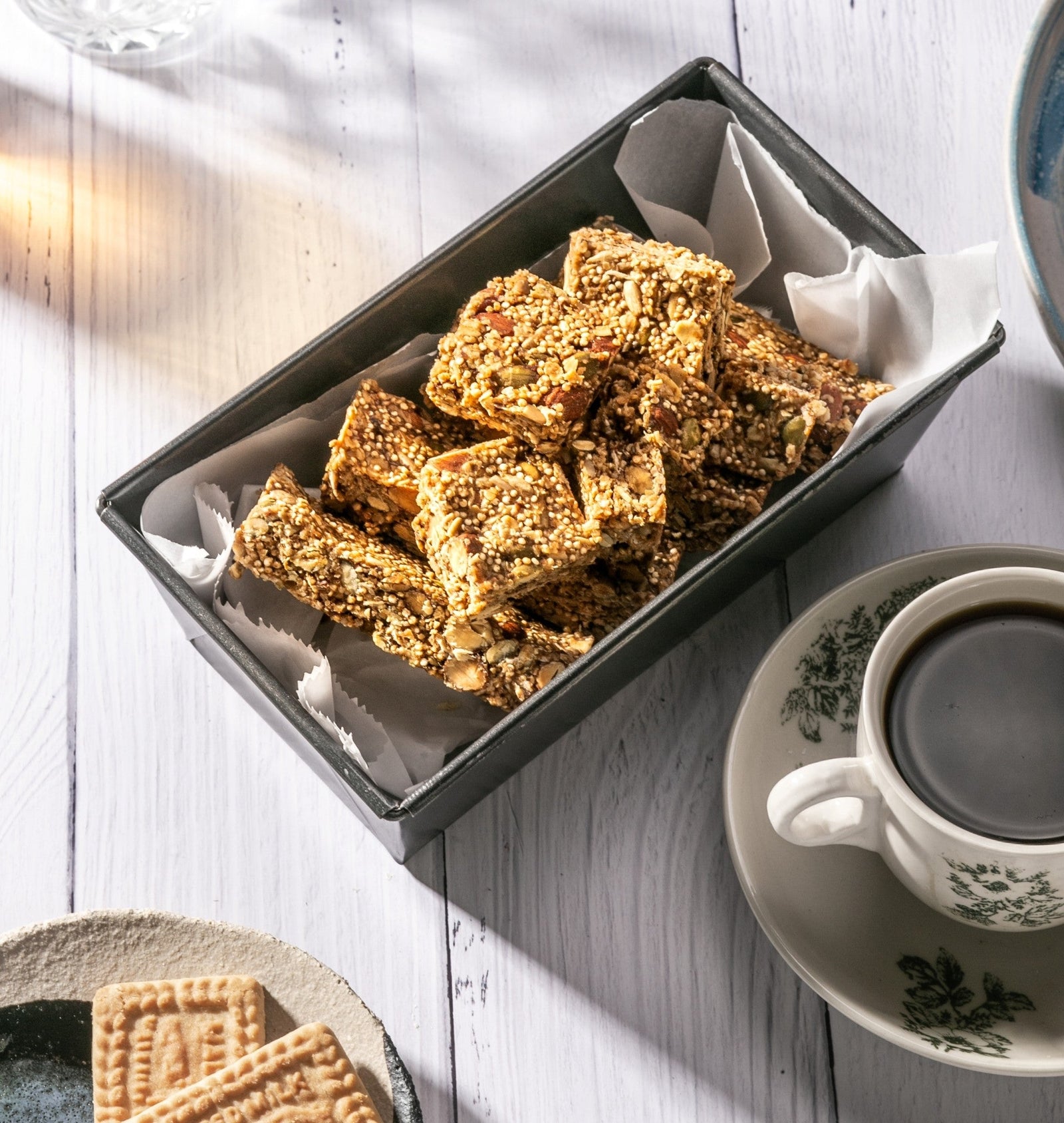Amazin’ Graze granola bars served with coffee and biscuits for a simple morning routine.